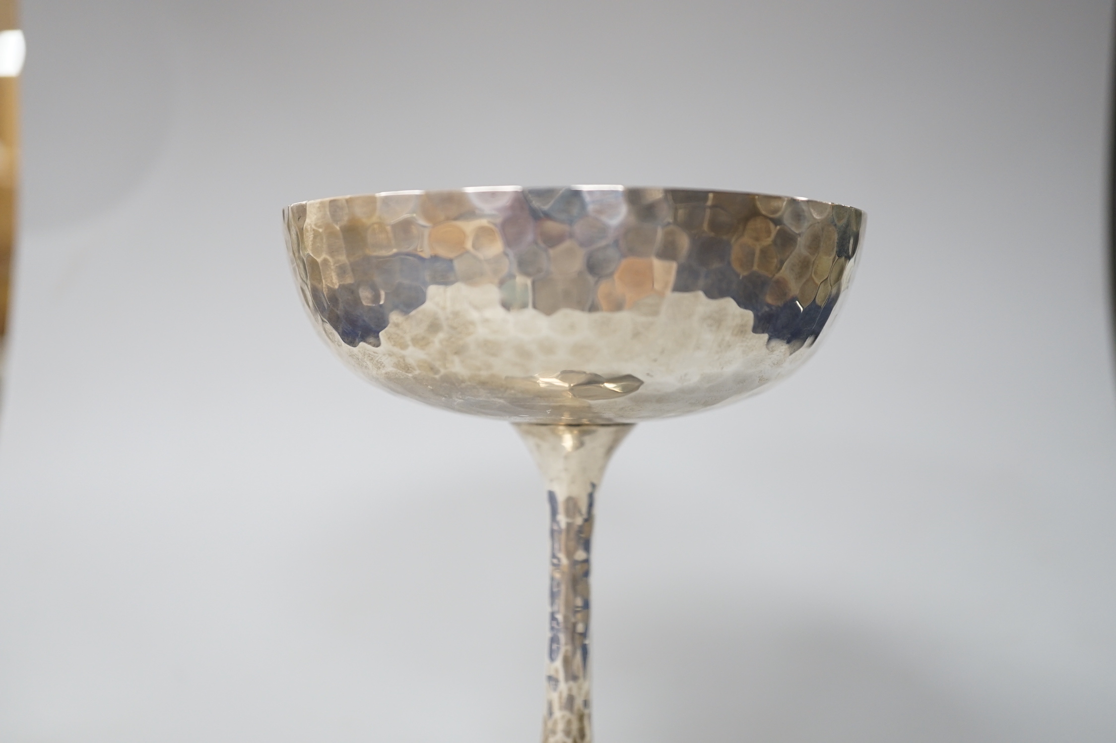 An Edwardian planished silver champagne coupe, makers Mappin & Webb, London 1903, 145 grams
